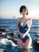 A woman in a blue bathing suit standing in the ocean.